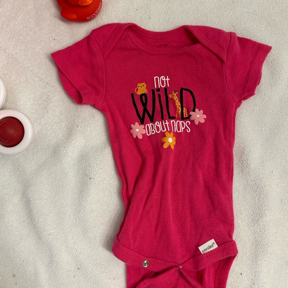Bright Pink Baby Onesie with Playful Print